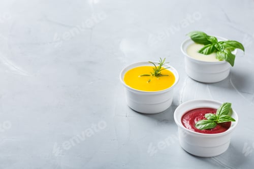 Preview: Set of seasonal fall autumn creamy soups on a table