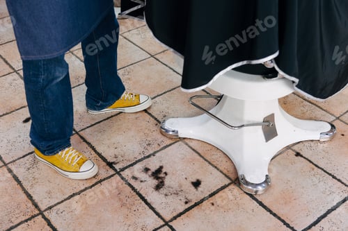 Preview: Cut hairs on the floor of a barbershop