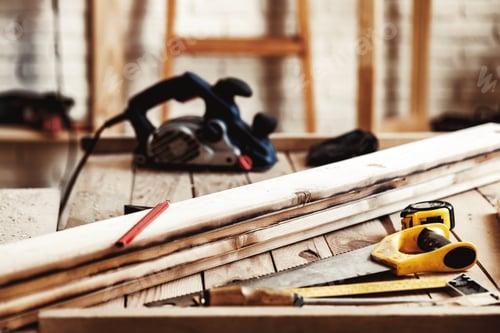 Preview: Hand saw on a wooden table in carpentry workshop