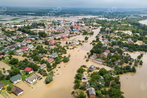 Preview: Aerial view of flooded houses with dirty water of Dnister river in Halych town, western Ukraine.