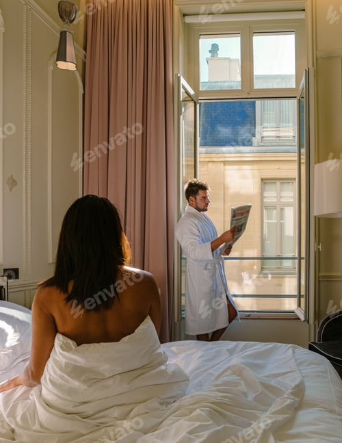 Preview: Morning wake up in bed in Paris with breakfast coffee and a newspaper,men and woman honymoon