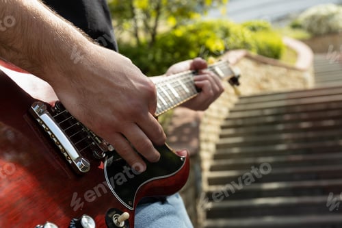Preview: A man plays a beautiful guitar close-up