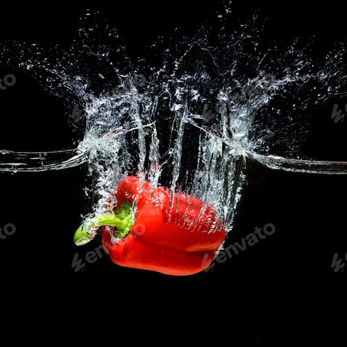 Preview: close up view of motion of red bell pepper falling into water isolated on black