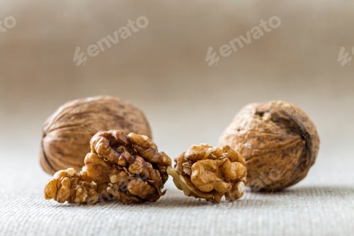 Preview: Close-up of walnuts, in wooden shell and kernels