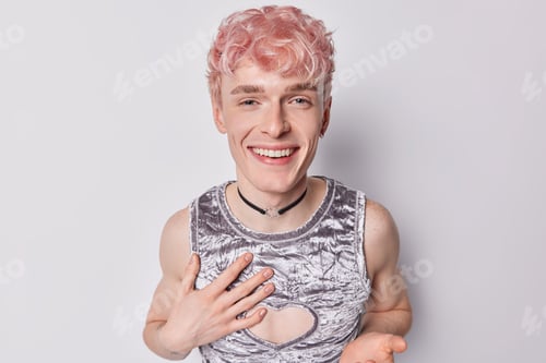 Preview: Handsome cheerful trans guy tries to affirm his gender laughs happily wears grey t shirt and chain