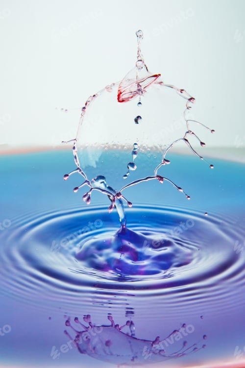 Preview: Abstract background of splash of color water, collision of colored drops