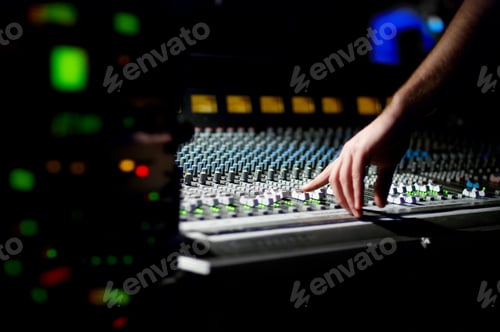Preview: hand of dj on the soundmixer in the nightclub