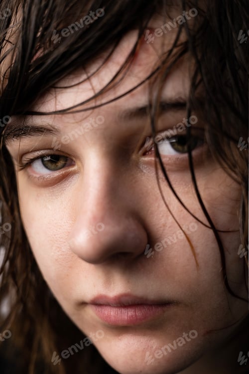 Preview: Closeup of a Young teen girl crying isolated on a white background - people and moods concept