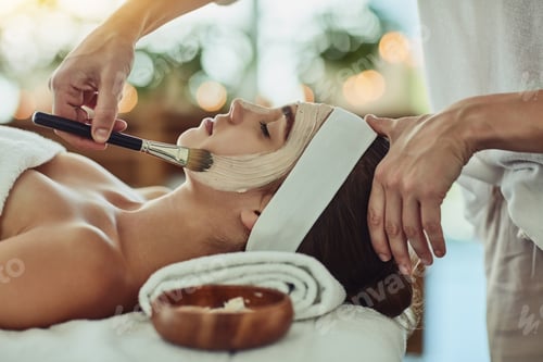 Preview: Shot of an attractive young woman getting a facial at a beauty spa