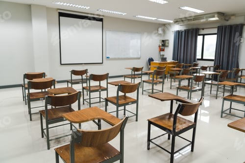 Preview: School classroom with many wooden chairs well-arranged in rows with no student