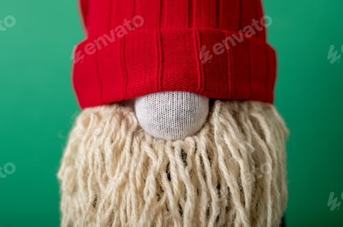 Preview: Handmade Christmas gnome on green background