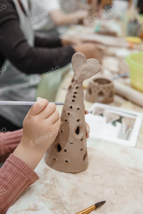 Preview: Women's hands knead clay, drawing elements of the product. Production of ceramic products