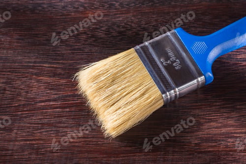 Preview: paint brush on wooden background, close-up
