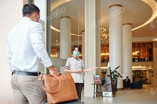 Hotel concierge welcoming guest