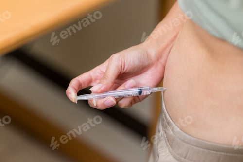 Preview: Woman injects hormones into the belly with a syringe