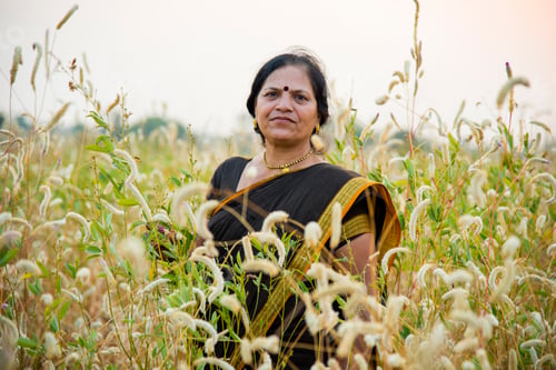 Preview: Smiling woman farmer in agricultural field