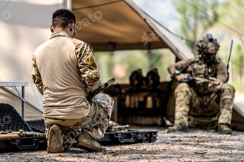 Preview: Special forces soldiers preparing tactical gear at military field base camp