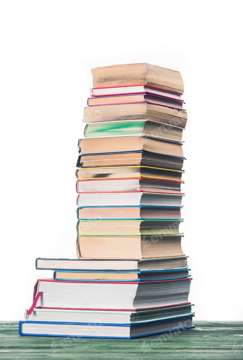 Preview: Knowledge concept with stacked books on table