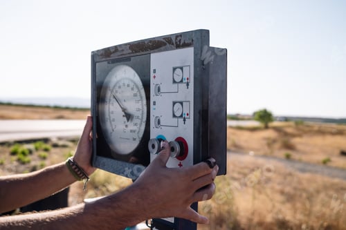 Preview: Man using pump station on roadside
