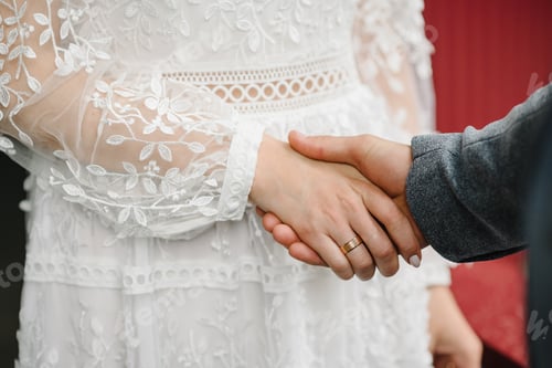 Preview: The bride and groom hold hands on the wedding ceremony. Hands with rings. Engagement. Close up.