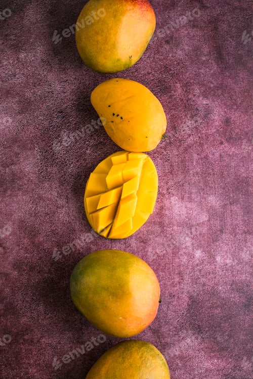 Preview: Mango background design concept. Top view of diced fresh mango fruit