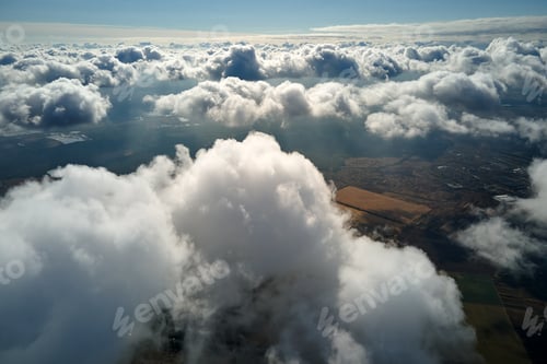 Preview: Aerial view at high altitude of earth covered with puffy cumulus clouds forming before rainstorm