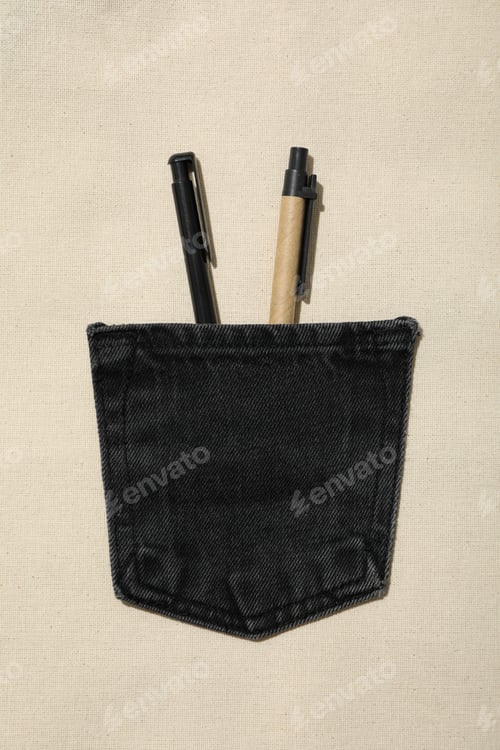 Preview: Denim pocket with pens on light background, top view