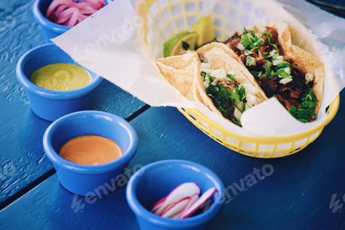 Preview: Tasty Tacos with Various Sauces on Blue Table