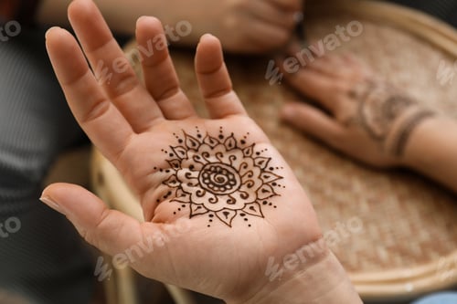 Preview: Master making henna tattoo, focus on hand. Traditional mehndi