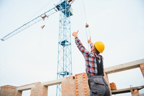 Preview: Construction worker in uniform and safety equipment have job on building.