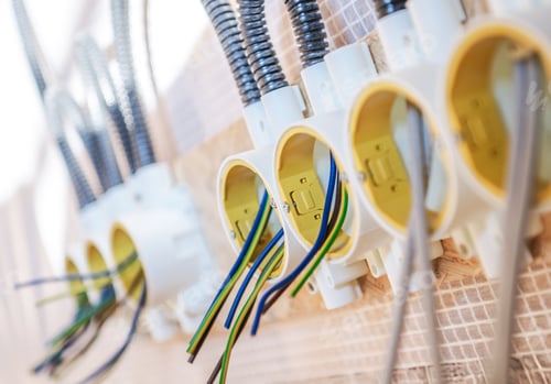 Preview: Electrical Outlets Mounted on a Wall With Colorful Wiring Connections