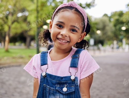 Preview: Portrait, young girl and smile in park, happy child outdoor with nature and freedom with positive m