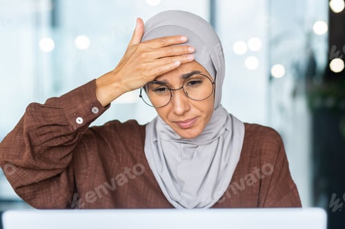 Preview: Tired business woman working at workplace inside office, Muslim woman with hijab is sick with