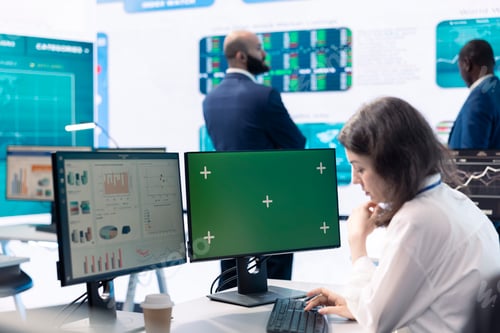 Preview: Woman general manager works with green screen and annual reports