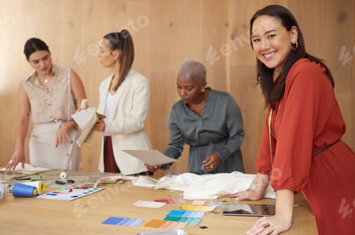 Preview: Were the perfect team for the job. Shot of a group of female designers working in an office.