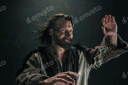 Preview: Portrait Of A Brutal Bald-Headed Viking In A Battle Mail Posing Against A Black Background.