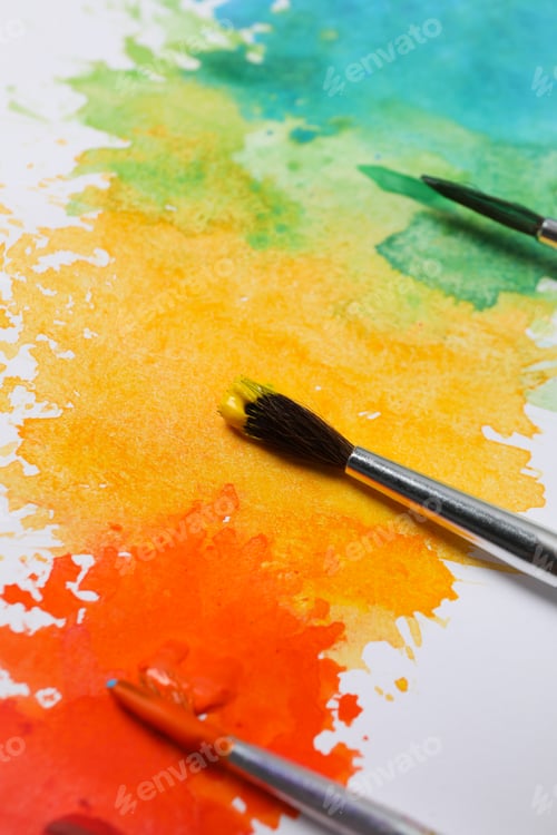 Preview: Paintbrushes with Yellow, Orange, Green, and Blue Watercolors