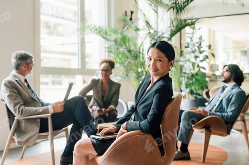 Preview: Italy, Portrait of businesswoman at meeting in creative studio