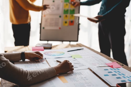 Preview: Ux ui designers come up with new ideas at a meeting to present in office mobile internet software
