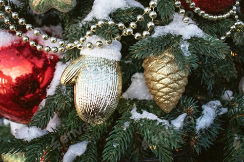 Preview: Christmas tree decorated with colorful balls and toys in the snow