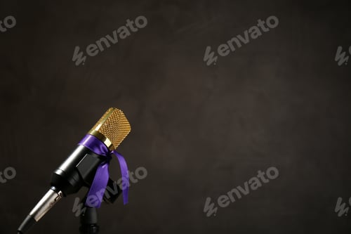 Preview: Microphone with purple awareness ribbon on dark background, space for text