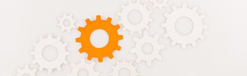 Preview: top view of one orange gear among another isolated on white, panoramic shot