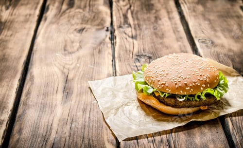 Preview: Fresh hamburger meat . On wooden background.