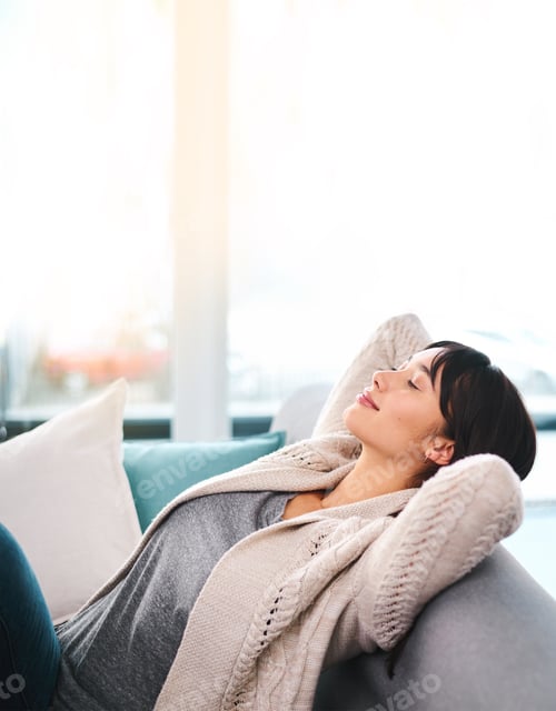 Preview: Woman Relaxing on Couch with Eyes Closed