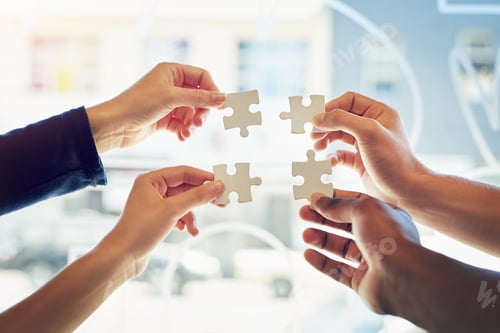 Preview: Shot of a group of unidentifiable friends holding up puzzle pieces toegther