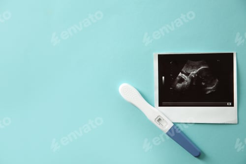 Preview: Ultrasound picture of baby and pregnancy test on color background, top view with space for text