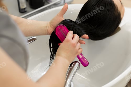 Preview: Woman Gets Hair Combed at Salon Sink