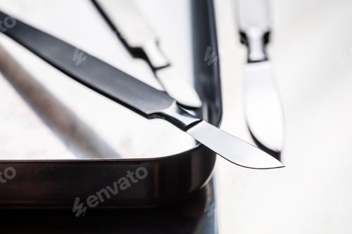 Preview: Surgical steel scalpels on stainless steel table