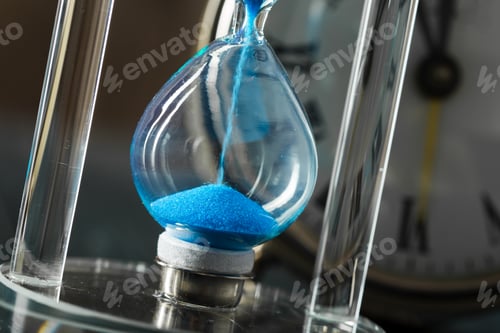 Preview: Time is passing. Blue hourglass close up