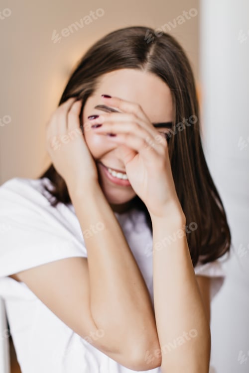 Preview: Close-up portrait of winsome brunette lady with trendy manicure. Indoor shot of attractive smiling